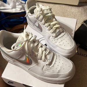 Gently worn air forces, all white with a metallic Nike sign. Women size 7.5.